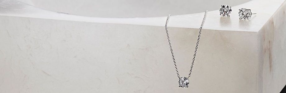 A collection of Lightbox lab-grown diamond jewelry with white, blue and pink stones A collection of Lightbox lab-grown diamond jewelry with white, blue and pink stones