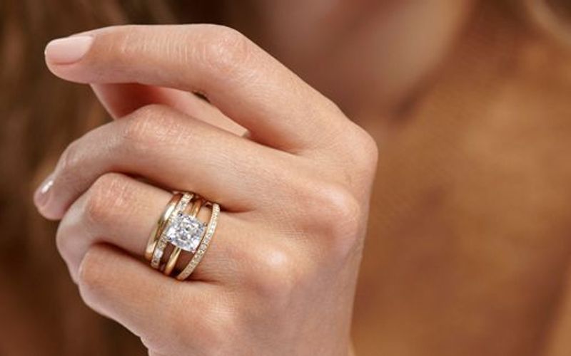 Engagement ring with bands on either side Engagement ring with bands on either side