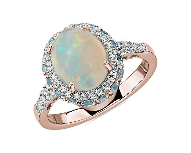 Oval Opal and Swiss Blue Topaz Halo Ring in 14k Rose Gold